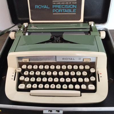Green and white 
Royal manual typewriter with case and manual.  Mint condition on case and machine
